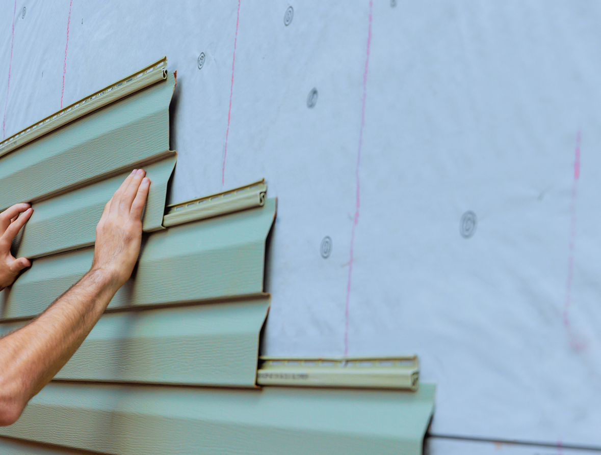 Installing green siding on house