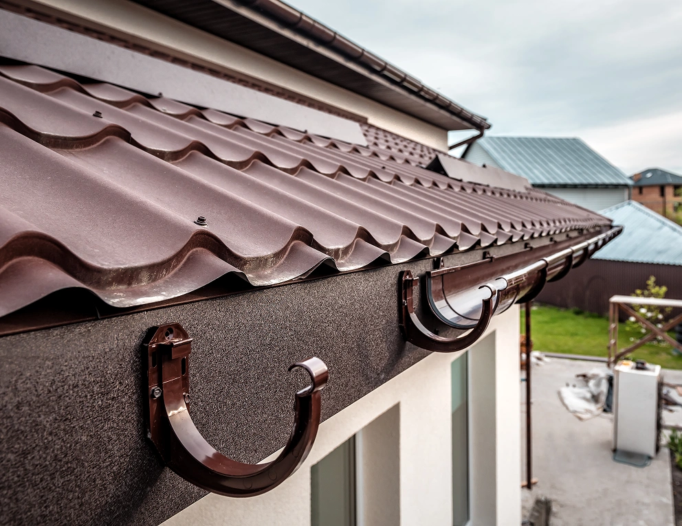 Brown metal roof with gutters